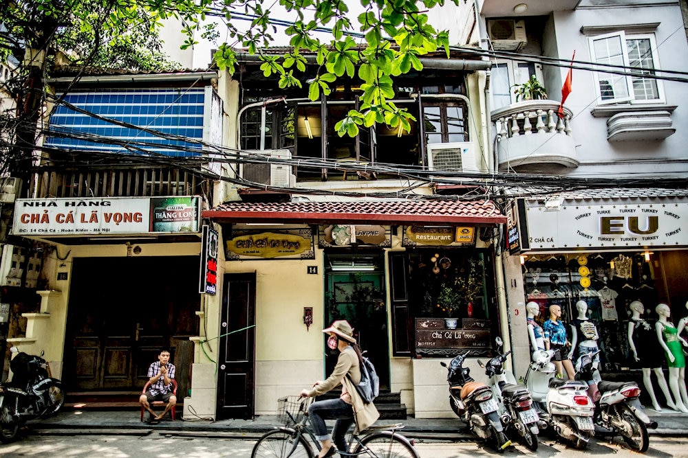 Cha Ca Street, nestled in Hanoi’s Old Quarter, is a narrow lane steeped in history, renowned as the birthplace of the iconic Cha Ca La Vong dish